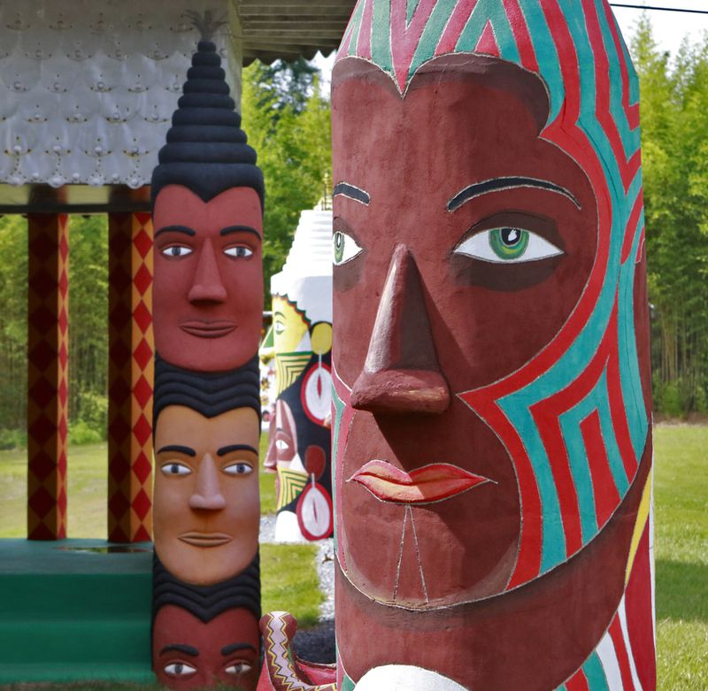 July 22, 2016 - Buena Vista, GA - Painted totems depicting Pasaquoyans appear throughout the site. Pasaquan is an art installation created by the late visionary artist Eddie Owens Martin in Buena Vista, Ga. The grounds features six buildings and 900 feet of cement fencing, all covered inside and out with colorful paintings. The site had fallen into disrepair, but starting in 2014 the Kohler Foundation began funding the restoration of the site, which has been given to Columbus State University to maintain when it reopens in October. BOB ANDRES / BANDRES@AJC.COM