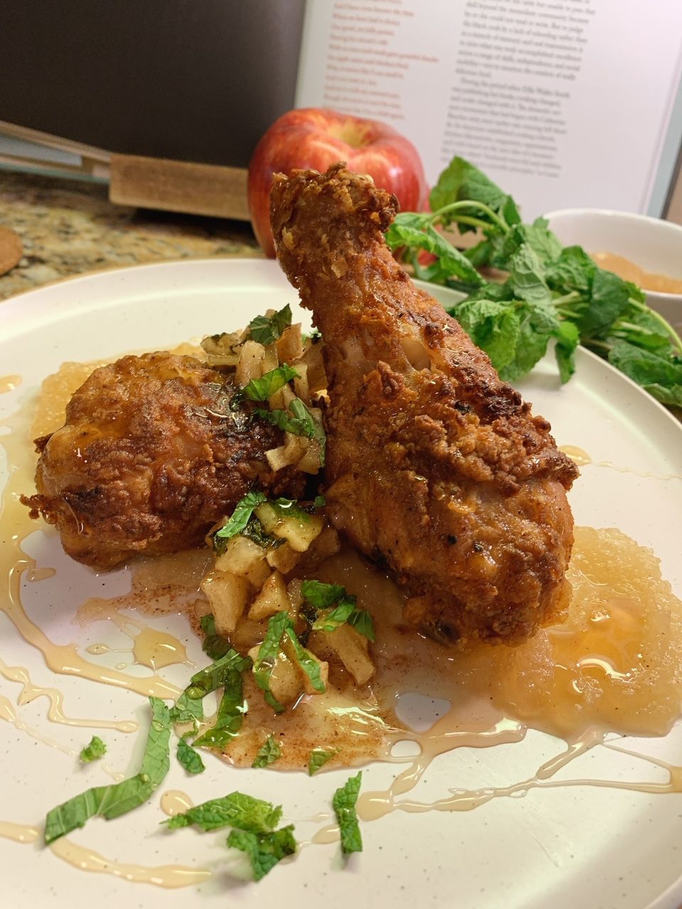 Fried chicken with an apple, basil, and thyme chutney and an apple gastrique over warm, homemade apple sauce from Liz and Leon’s in Atlanta. 